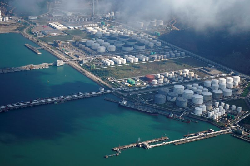 Oil prices edge down on US inventory build, OPEC forecast shift