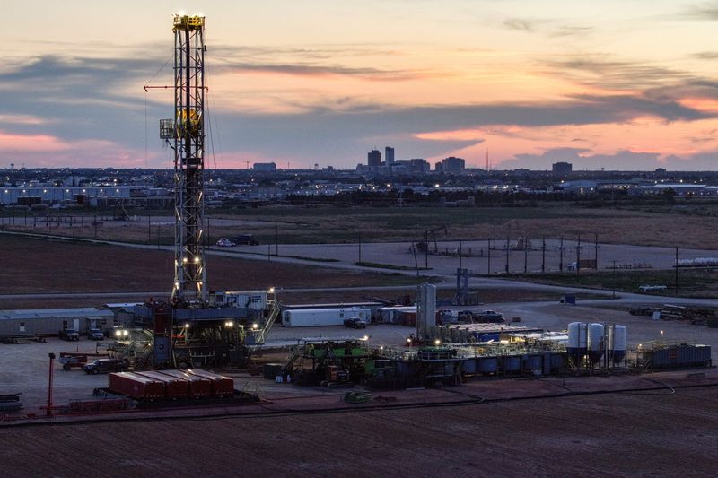 Oil climbs after hitting one-month low; supply glut weighs