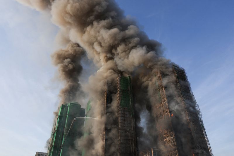 Four dead after fire engulfs residential high-rise buildings in Hong Kong