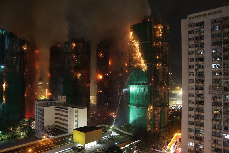 Hong Kong police arrest three as apartment fire death toll rises to 44, hundreds missing