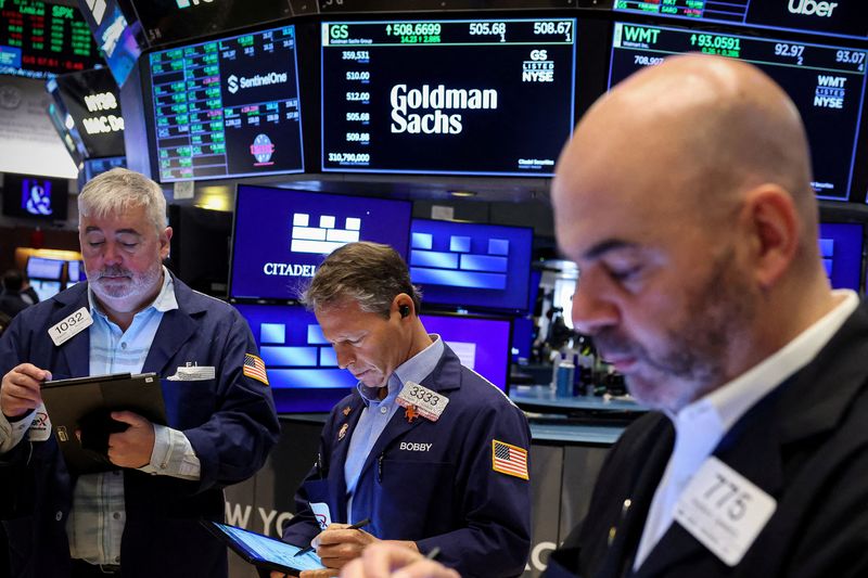 Wall St closes higher fueled by tech rally, soft inflation data