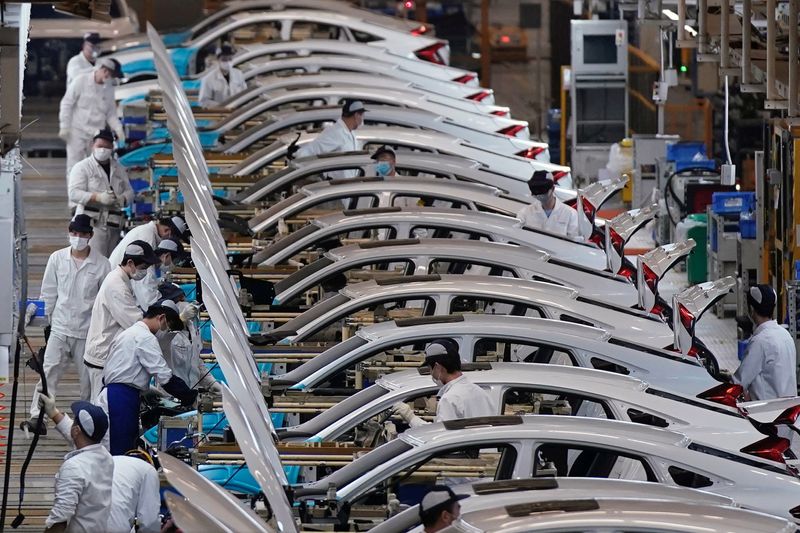 China’s factory activity edges back to growth in December, private PMI shows