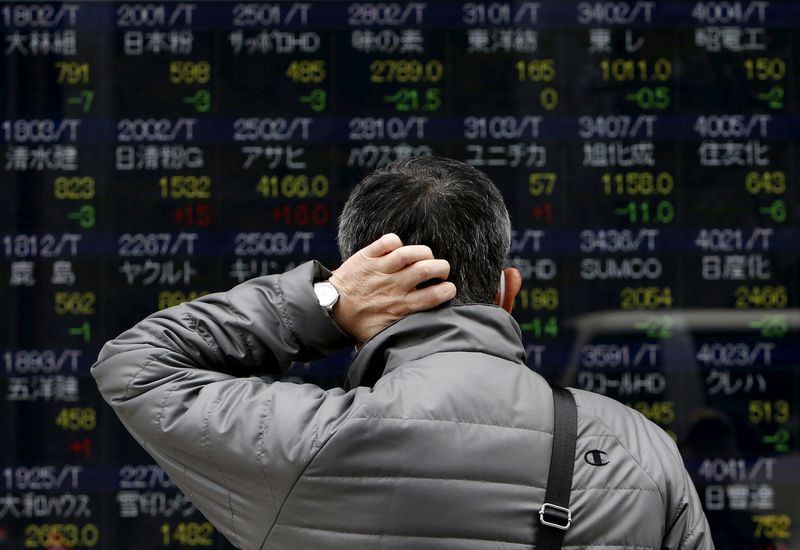 Asian shares shrug off Venezuela impact and climb; oil volatile