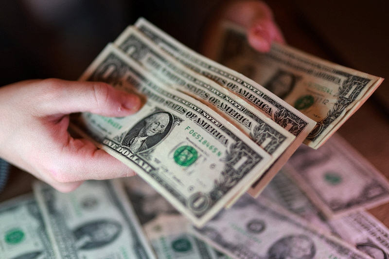 Dollar firms as oil climbs, bond rout saps risk appetite