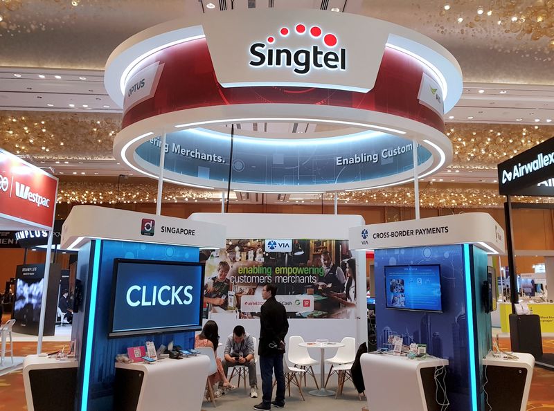 Singtel's quarterly earnings nearly triple, shares hover around six-year highs
