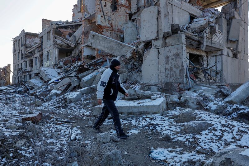 Villagers in Russian-controlled Ukraine visit homes destroyed in long conflict