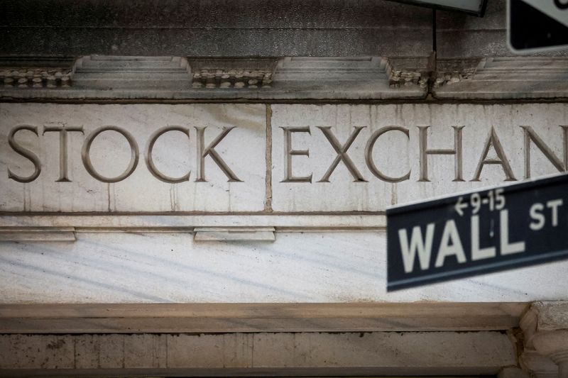 Wall St ends higher after Fed chief's comments, but posts big weekly loss