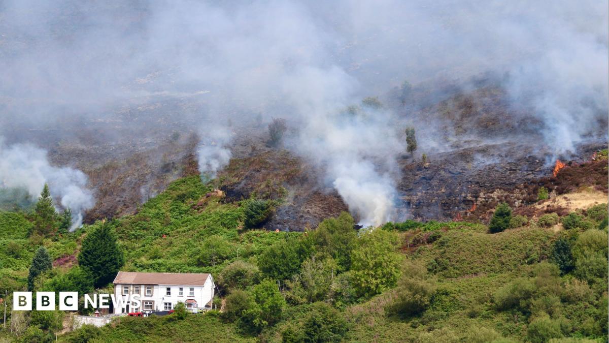 Fires started 'deliberately' on mountain as crews tackle blaze